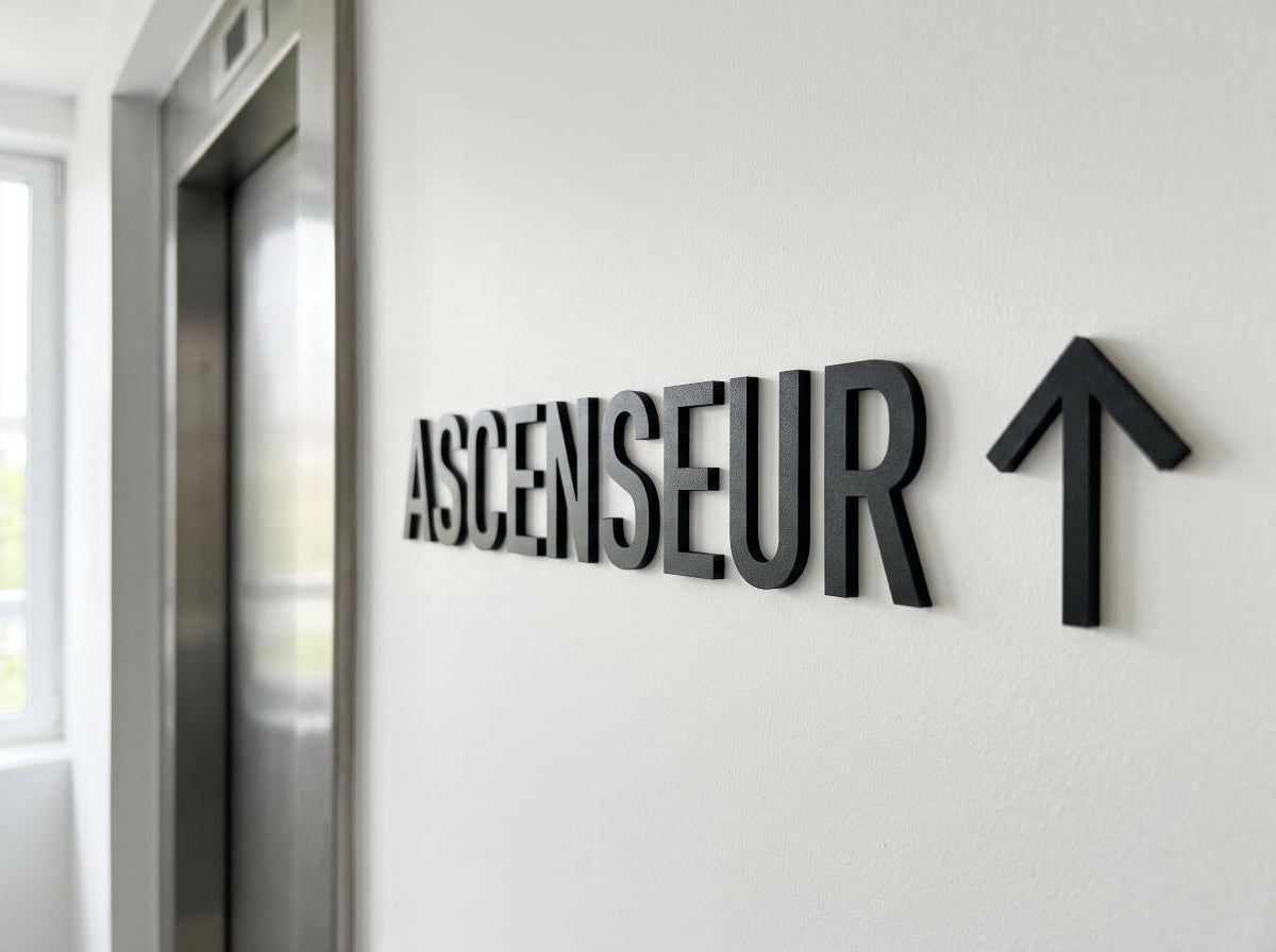 Fléchage ascenseur — vue de détail